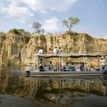 A tour boat cruising the Nile in Murchison Falls National Park